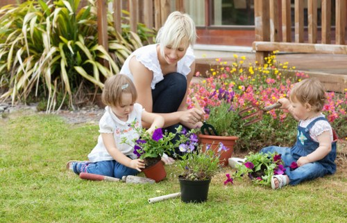 Staff training session outdoors with gardening equipment